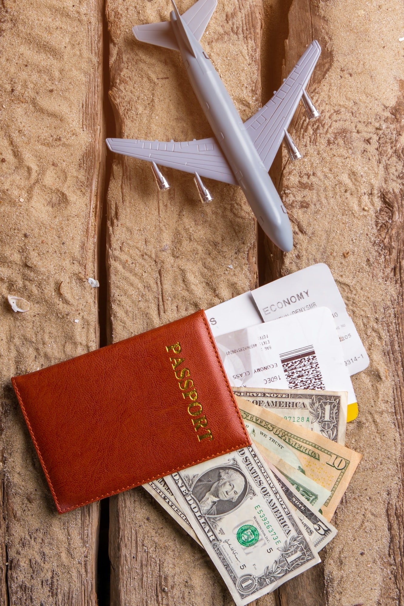 Toy Plane And Brown Passport