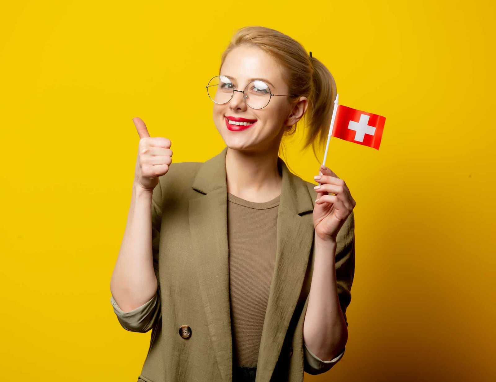 Style Blonde Woman In Jacket With Swiss Flag On Yellow Background