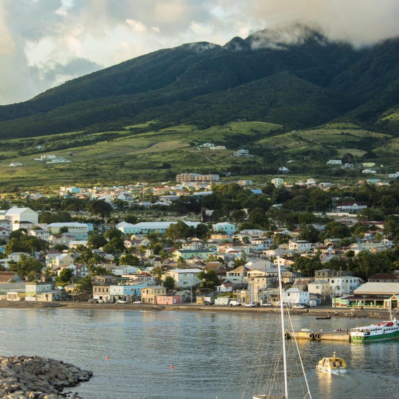 Basseterre, St Kitts with Mt Liamuiga volcano in the background at sunset.