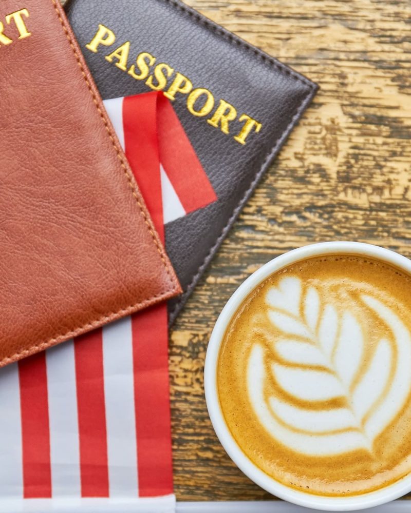 Coffee, Passports And Us Flag, Uae Golden Visa Agency, Singapore Citizenship Agency