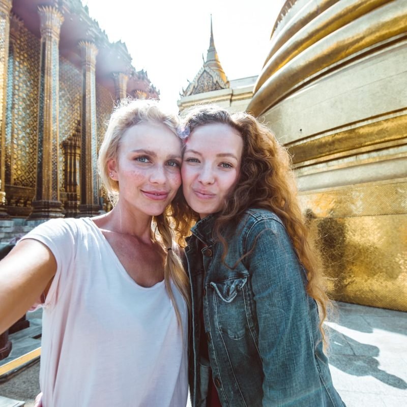 Couple Of Beautiful Girls Visiting Bangkok Maining Attractions