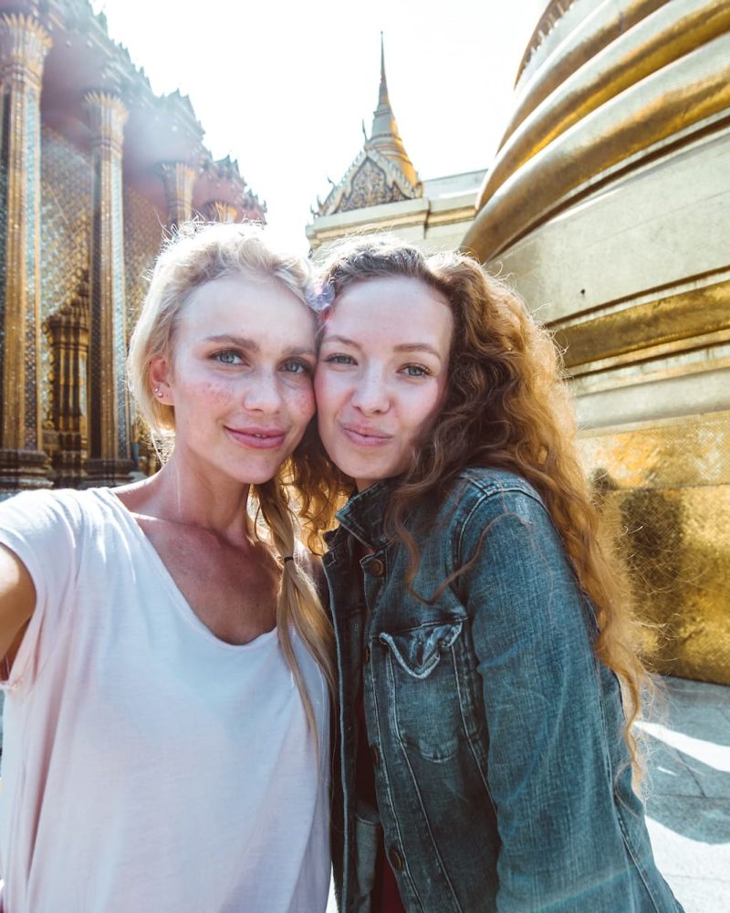 Couple Of Beautiful Girls Visiting Bangkok Maining Attractions