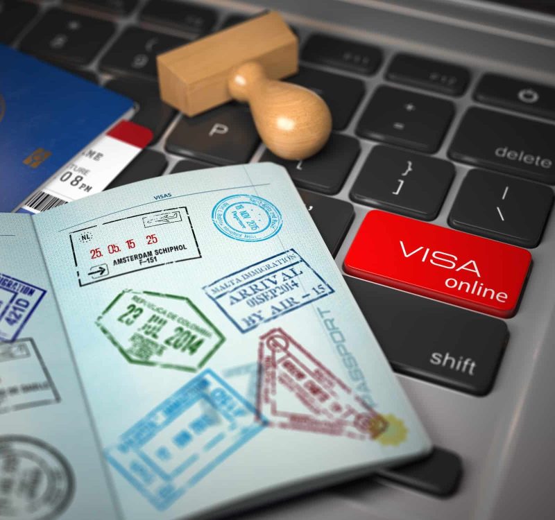 Visa Online Application Concept. Open Passport With Visa Stamps