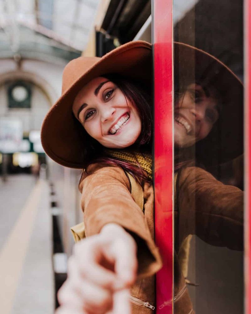 young beautiful woman travelling in a train in Porto station, Portugal. Travel concept